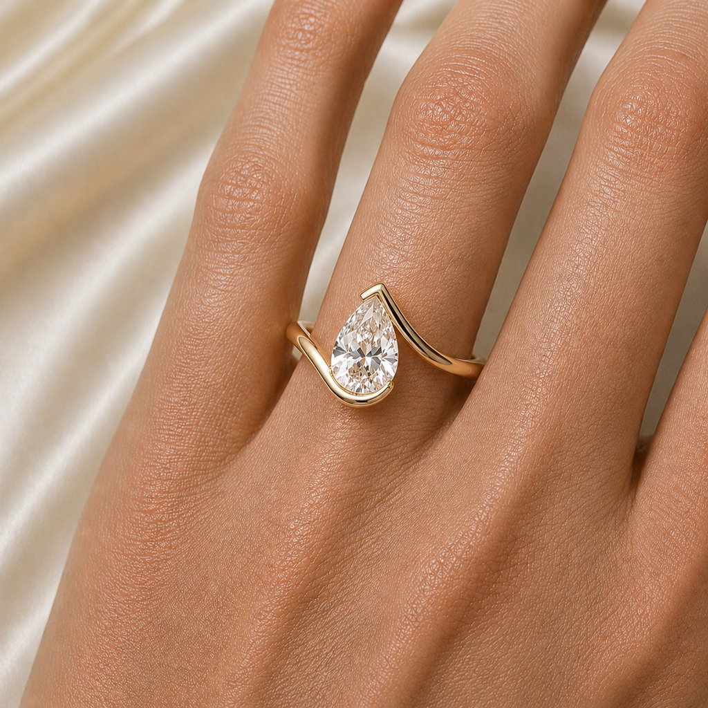 Pear Cut Moissanite Ring in 18K Gold, Open Wrap Engagement Ring | SEÓRA