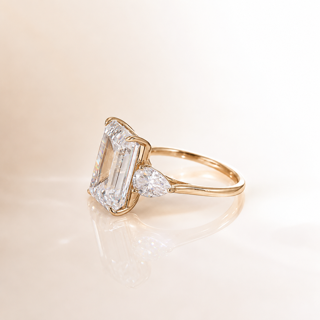 4Ct Emerald Cut Moissanite Ring with Pear Side Stones | 18 K Gold | SEÓRA